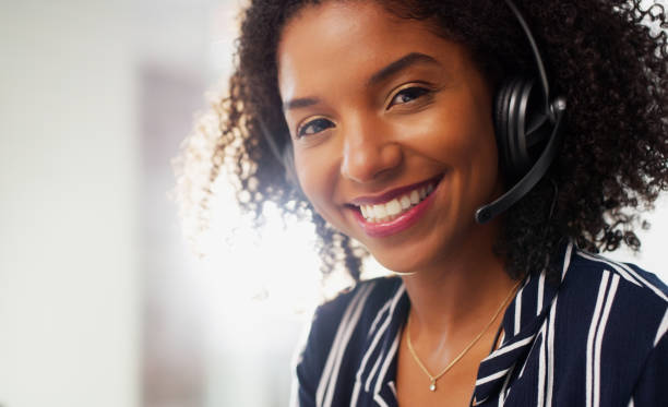 Cropped portrait of an attractive young businesswoman wearing a headset while in the office during the day